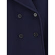 Blue Wool CoatThe Chloé oversized double breasted Wool Coat is a sleek, structured piece for the cold season. Featuring wide lapels and a collar strap, it is finished with engraved horn buttons at the collar, front and cuffs. Side pockets and a knee-lengt