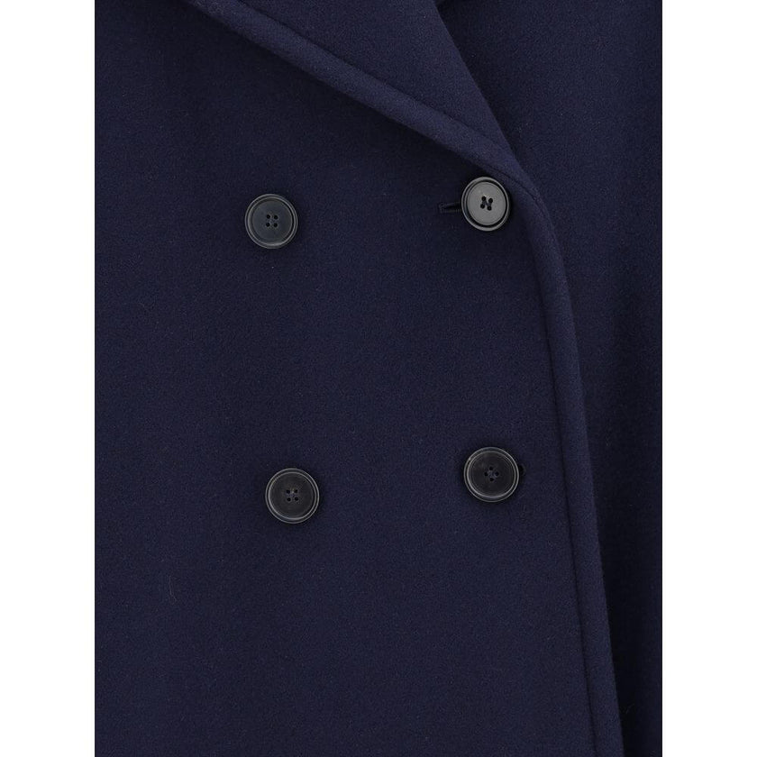 Blue Wool CoatThe Chloé oversized double breasted Wool Coat is a sleek, structured piece for the cold season. Featuring wide lapels and a collar strap, it is finished with engraved horn buttons at the collar, front and cuffs. Side pockets and a knee-lengt