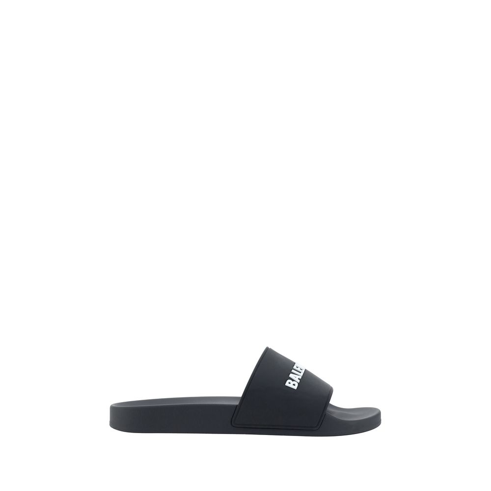 Black Rubber Flat SandalsBalenciaga’s Rubber Pool Sandals are a slip-on style with a minimal and contemporary style. Featuring a flat sole for maximum comfort, they feature the brand’s iconic contrasting signature on the front strap, which adds a distinct