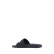 Black Rubber Flat SandalsBalenciaga’s Rubber Pool Sandals are a slip-on style with a minimal and contemporary style. Featuring a flat sole for maximum comfort, they feature the brand’s iconic contrasting signature on the front strap, which adds a distinct
