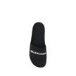 Black Rubber Flat SandalsBalenciaga’s Rubber Pool Sandals are a slip-on style with a minimal and contemporary style. Featuring a flat sole for maximum comfort, they feature the brand’s iconic contrasting signature on the front strap, which adds a distinct