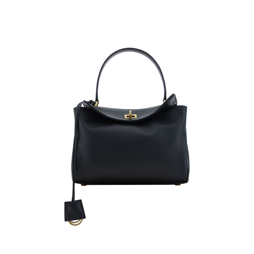 Black Calf Leather Bos Taurus Shoulder BagBalenciaga’s signature leather Rodeo Shoulder Bag is a sophisticated and versatile accessory. The flat handle at the top offers a comfortable grip, while the removable shoulder strap allows you to adapt it to your