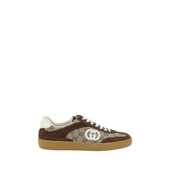 Brown Calf Leather Bos Taurus Low Top SneakersGucci’s Sneakers feature suede details that add a touch of elegance and softness to the design. The iconic GG fabric is repeated all-over, giving a distinctive and recognizable look. The front lace-up closure