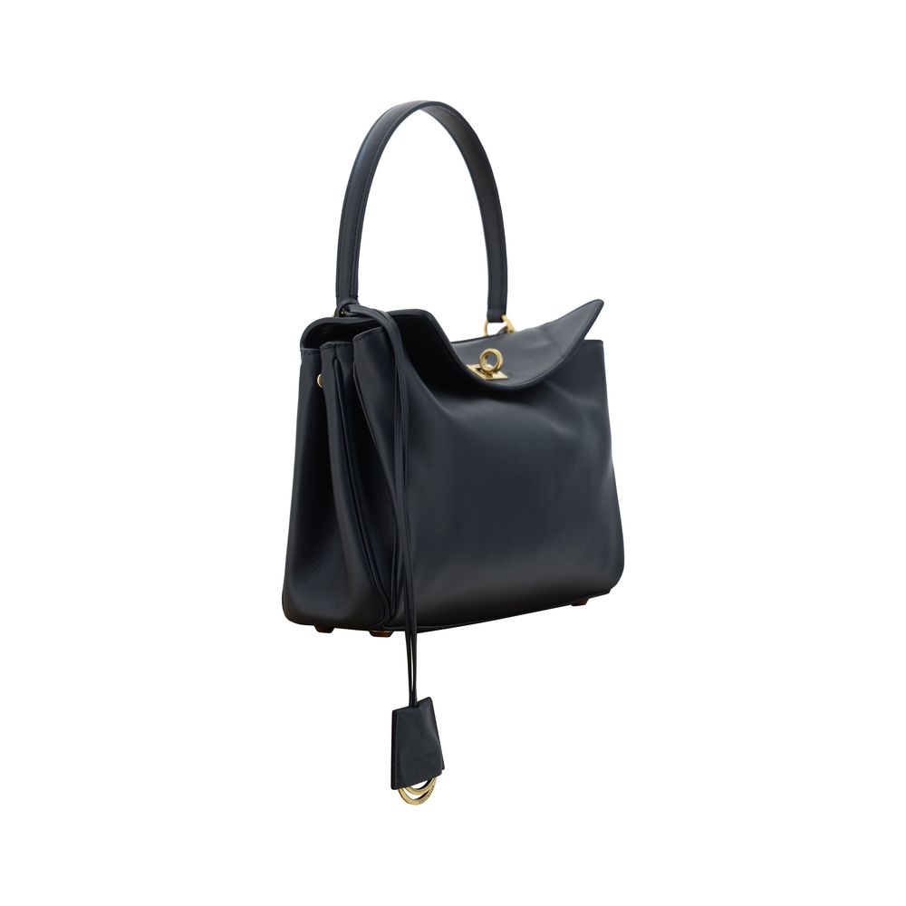 Black Calf Leather Bos Taurus Shoulder BagBalenciaga’s signature leather Rodeo Shoulder Bag is a sophisticated and versatile accessory. The flat handle at the top offers a comfortable grip, while the removable shoulder strap allows you to adapt it to your