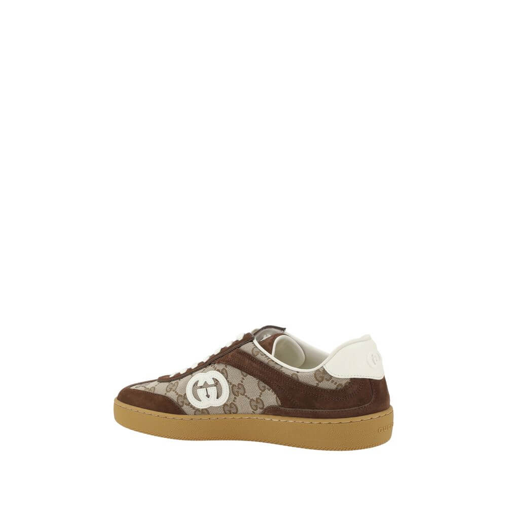 Brown Calf Leather Bos Taurus Low Top SneakersGucci’s Sneakers feature suede details that add a touch of elegance and softness to the design. The iconic GG fabric is repeated all-over, giving a distinctive and recognizable look. The front lace-up closure