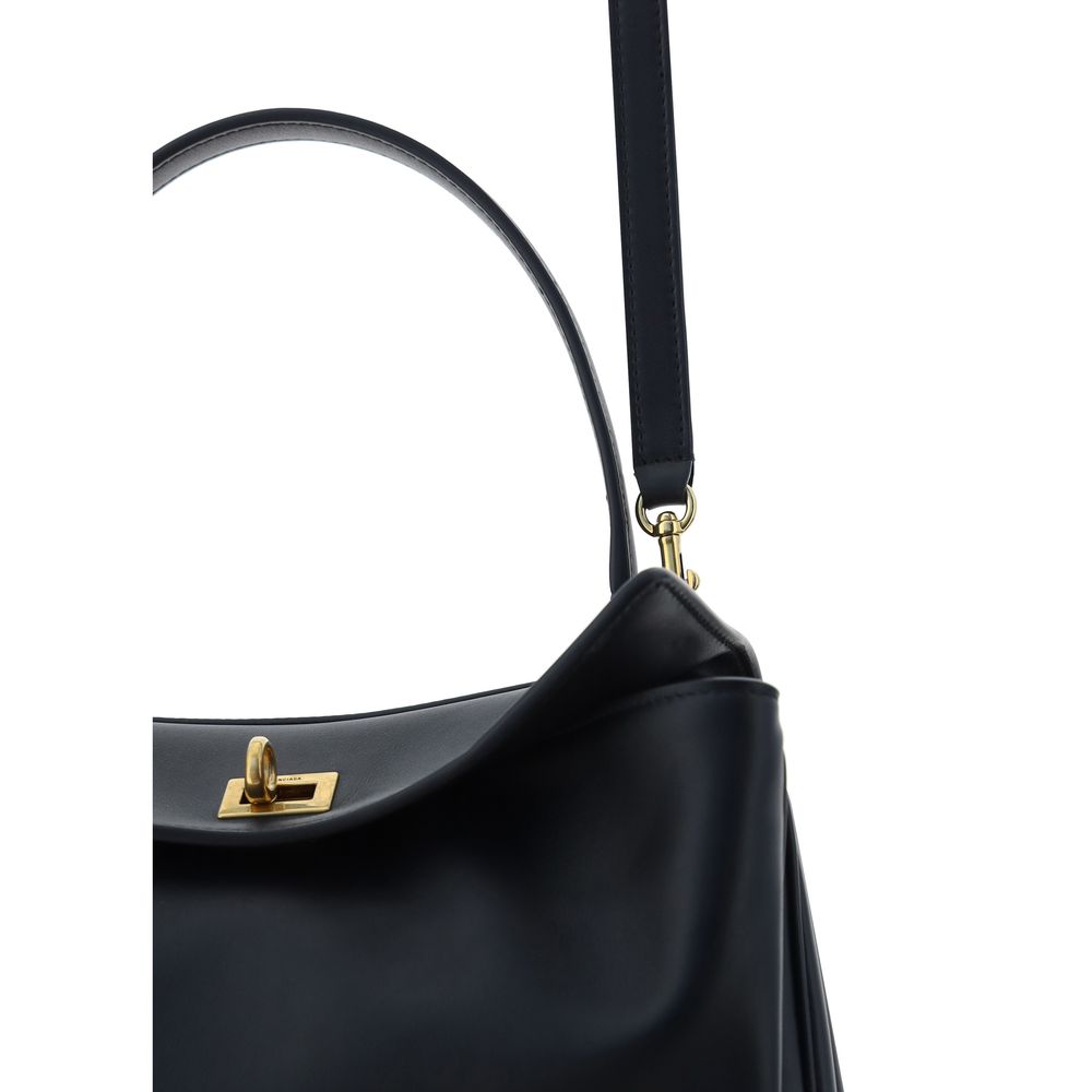 Black Calf Leather Bos Taurus Shoulder BagBalenciaga’s signature leather Rodeo Shoulder Bag is a sophisticated and versatile accessory. The flat handle at the top offers a comfortable grip, while the removable shoulder strap allows you to adapt it to your