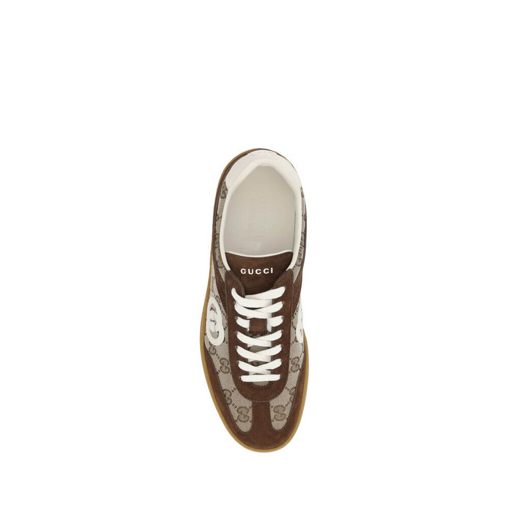 Brown Calf Leather Bos Taurus Low Top SneakersGucci’s Sneakers feature suede details that add a touch of elegance and softness to the design. The iconic GG fabric is repeated all-over, giving a distinctive and recognizable look. The front lace-up closure