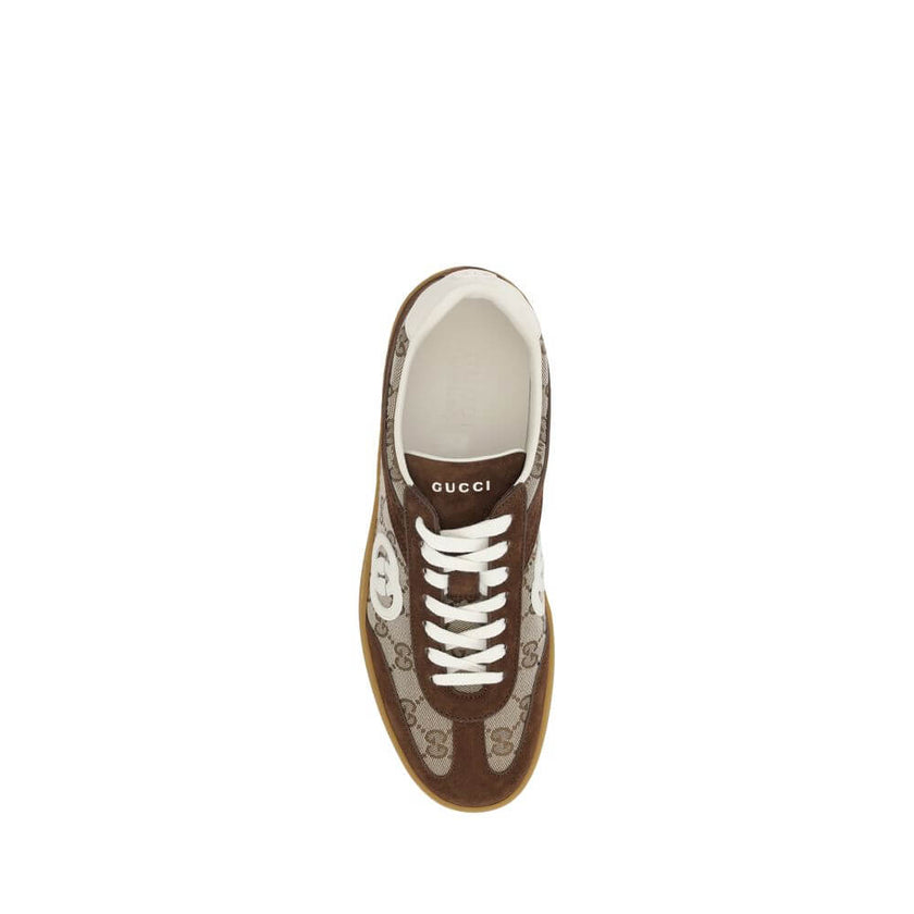 Brown Calf Leather Bos Taurus Low Top SneakersGucci’s Sneakers feature suede details that add a touch of elegance and softness to the design. The iconic GG fabric is repeated all-over, giving a distinctive and recognizable look. The front lace-up closure