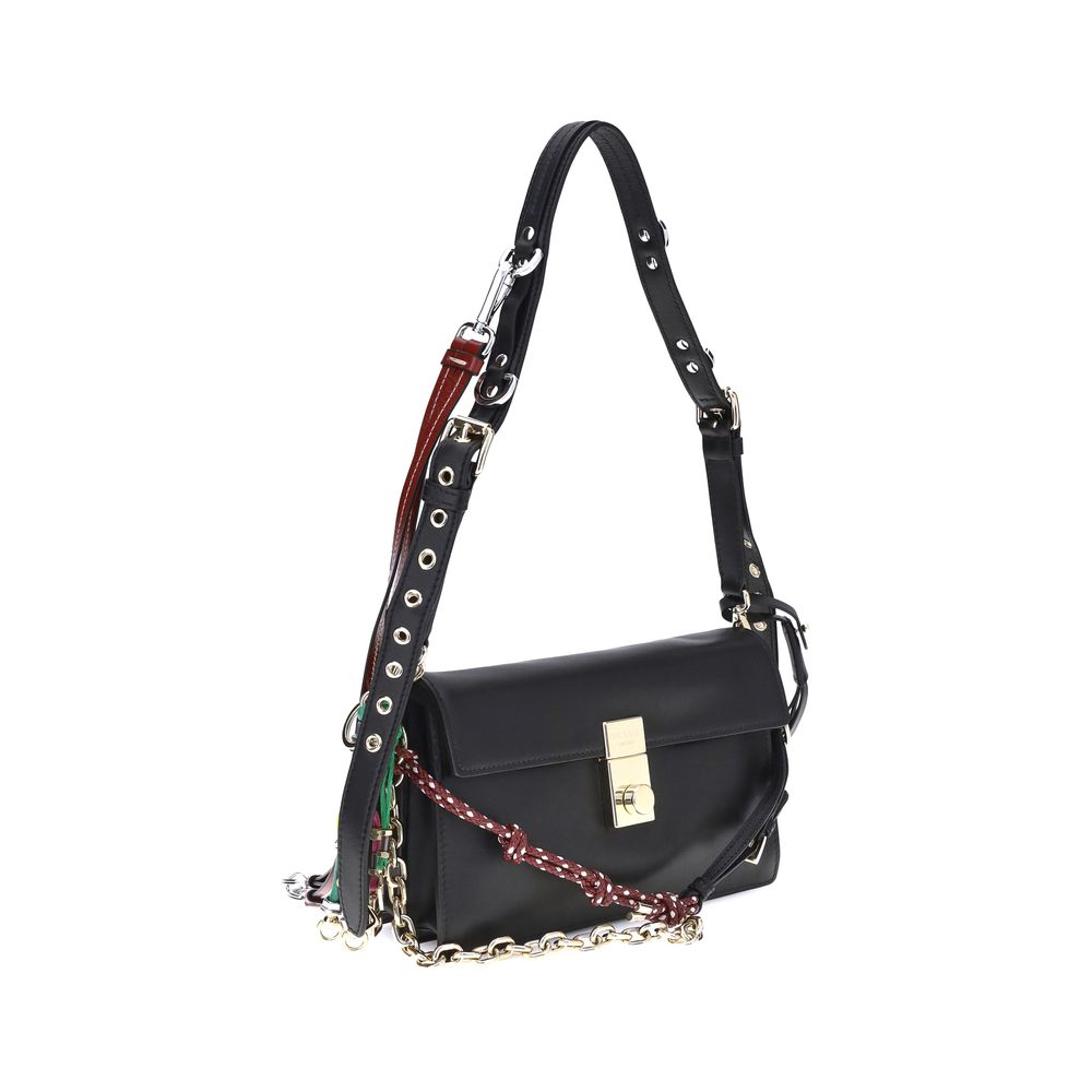 Black Calf Leather Bos Taurus Shoulder BagPrada’s Soft Sound Small Shoulder Bag combines soft lines and refined details in a compact and functional design. Made of lightly grained leather, it is embellished with a metallic logo detail on the front and rem