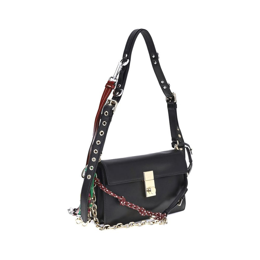 Black Calf Leather Bos Taurus Shoulder BagPrada’s Soft Sound Small Shoulder Bag combines soft lines and refined details in a compact and functional design. Made of lightly grained leather, it is embellished with a metallic logo detail on the front and rem