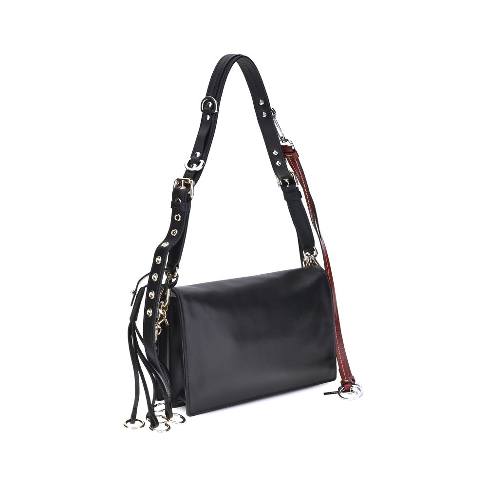 Black Calf Leather Bos Taurus Shoulder BagPrada’s Soft Sound Small Shoulder Bag combines soft lines and refined details in a compact and functional design. Made of lightly grained leather, it is embellished with a metallic logo detail on the front and rem