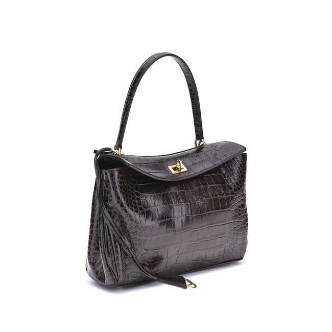 Black Calf Leather Bos Taurus Shoulder BagThe Rodeo Shoulder Bag in crocodile-print leather by Balenciaga features a top handle for a comfortable and elegant grip. The front closure is equipped with a flap and turn lock, adding a distinctive and functiona