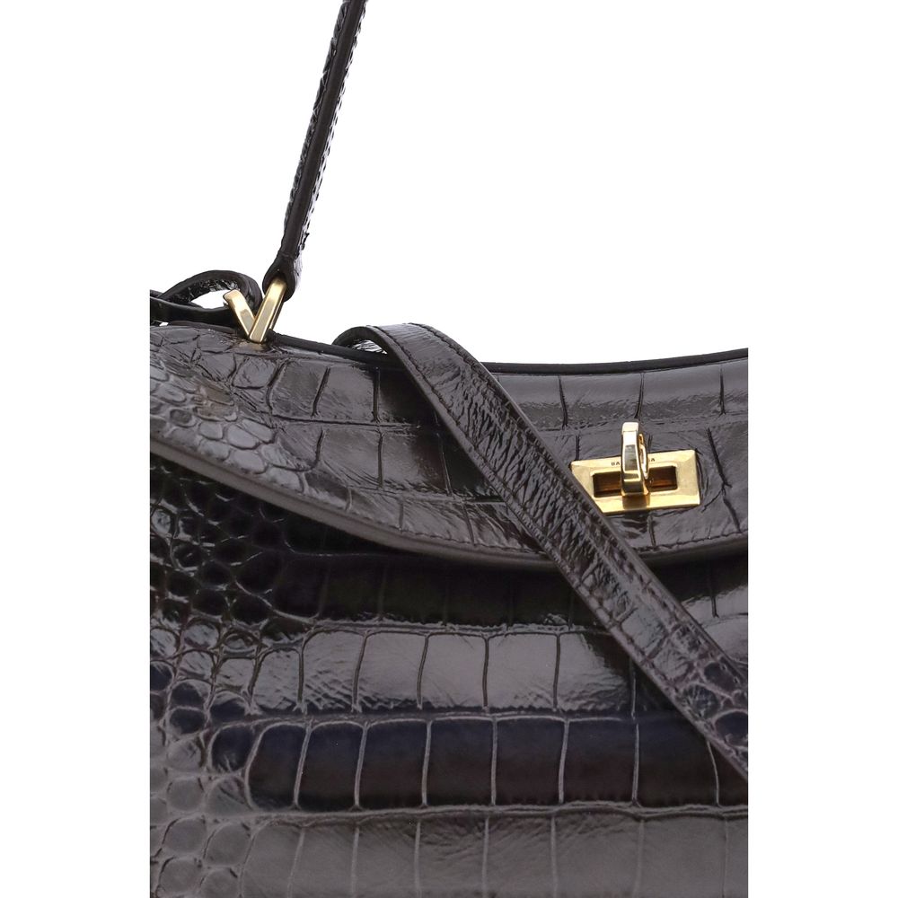 Black Calf Leather Bos Taurus Shoulder BagThe Rodeo Shoulder Bag in crocodile-print leather by Balenciaga features a top handle for a comfortable and elegant grip. The front closure is equipped with a flap and turn lock, adding a distinctive and functiona