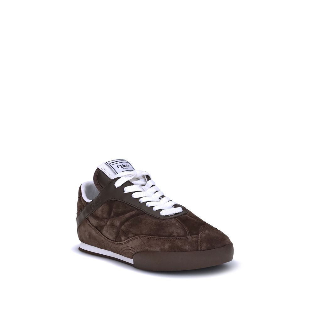 Brown Calf Leather Bos Taurus Low Top SneakersThe Kick Suede Sneakers by Chloé combine style and comfort. They feature a round toe and a paneled design that creates a dynamic visual effect. Suede details add a refined texture, while the front lace-up clos
