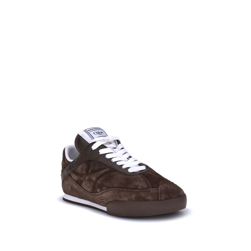 Brown Calf Leather Bos Taurus Low Top SneakersThe Kick Suede Sneakers by Chloé combine style and comfort. They feature a round toe and a paneled design that creates a dynamic visual effect. Suede details add a refined texture, while the front lace-up clos