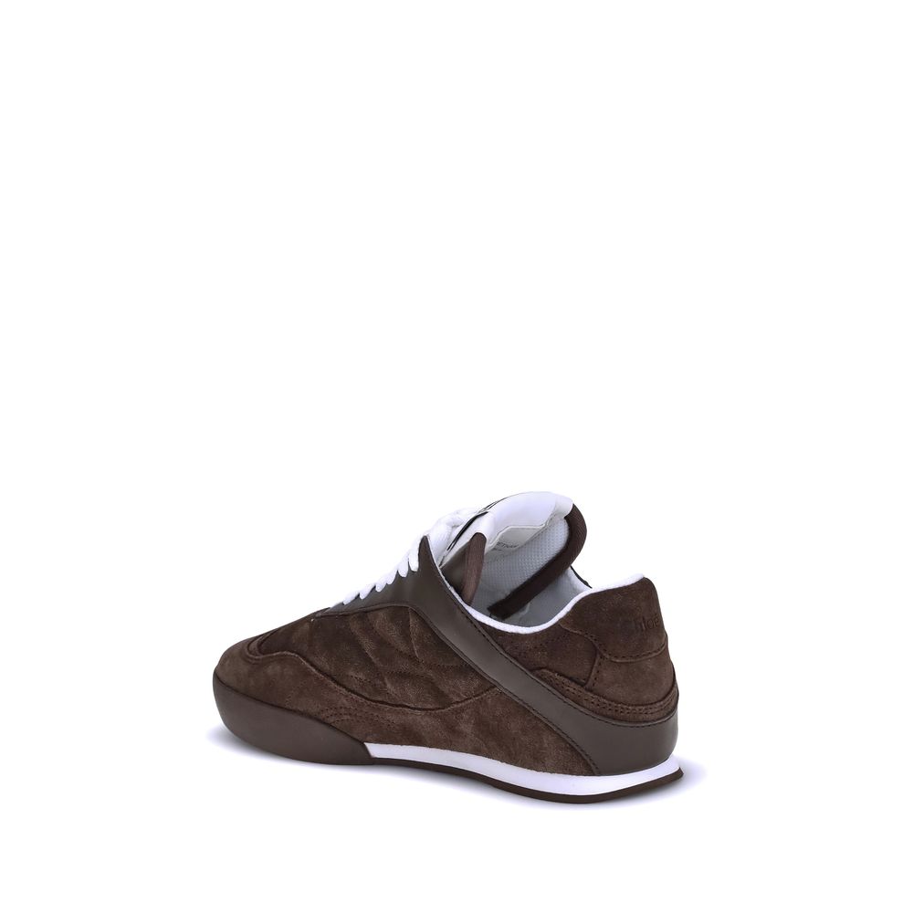 Brown Calf Leather Bos Taurus Low Top SneakersThe Kick Suede Sneakers by Chloé combine style and comfort. They feature a round toe and a paneled design that creates a dynamic visual effect. Suede details add a refined texture, while the front lace-up clos