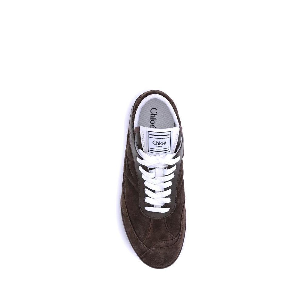 Brown Calf Leather Bos Taurus Low Top SneakersThe Kick Suede Sneakers by Chloé combine style and comfort. They feature a round toe and a paneled design that creates a dynamic visual effect. Suede details add a refined texture, while the front lace-up clos