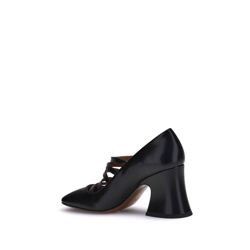 Black Calf Leather Bos Taurus High Heel PumpsThe Janis Pumps by Chloé are crafted from shiny calfskin and feature a bell-shaped block heel and slightly squared toe. The adjustable straps, embellished with gold buckles engraved with the Chloé logo, add a r