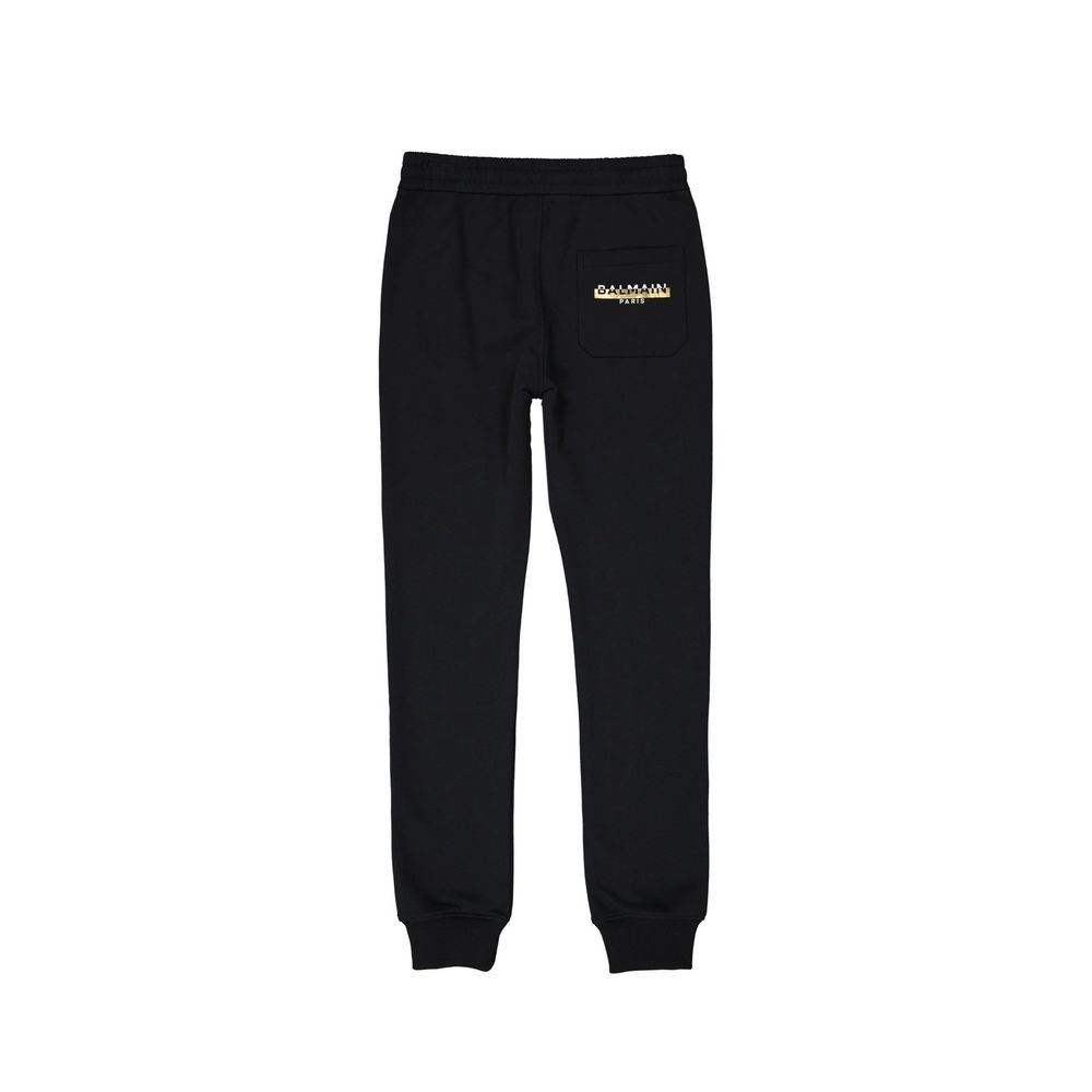 Black Cotton Joggers (Workout Pants)Description: – Composition: 100% Cotton – Two side pockets – Machine wash – Back logo detail – Drawstring waist – One back pocket – Made in Portugal – Gender: MEN –Black Cotton Joggers (Workout Pants)${tagsBalmainAulae