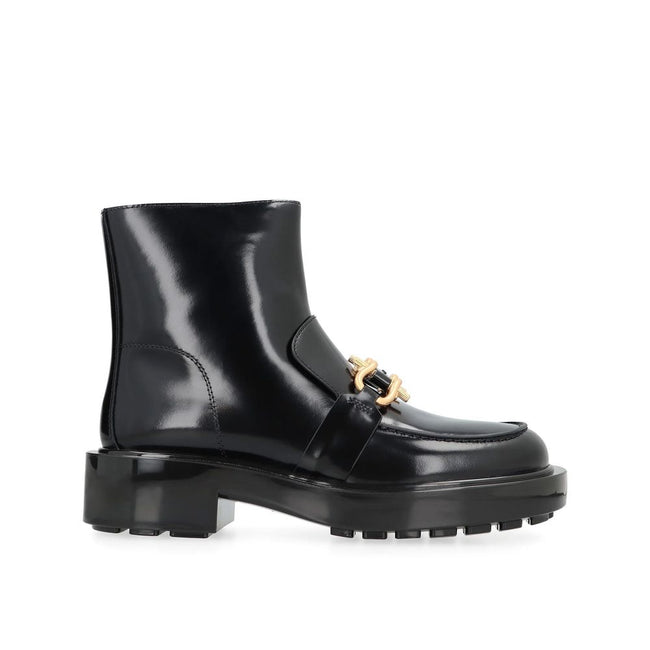 Black Calfskin Ankle BootsDescription: – Composition: 100% calf leather – Inner: 100% Leather – Insole: 100% Leather – Sole: 100% Rubber – Round toe – Side zip closure – Glossy leather – Chunky lugged rubber outsole – Made in Italy – Gender: WOMEN –Black
