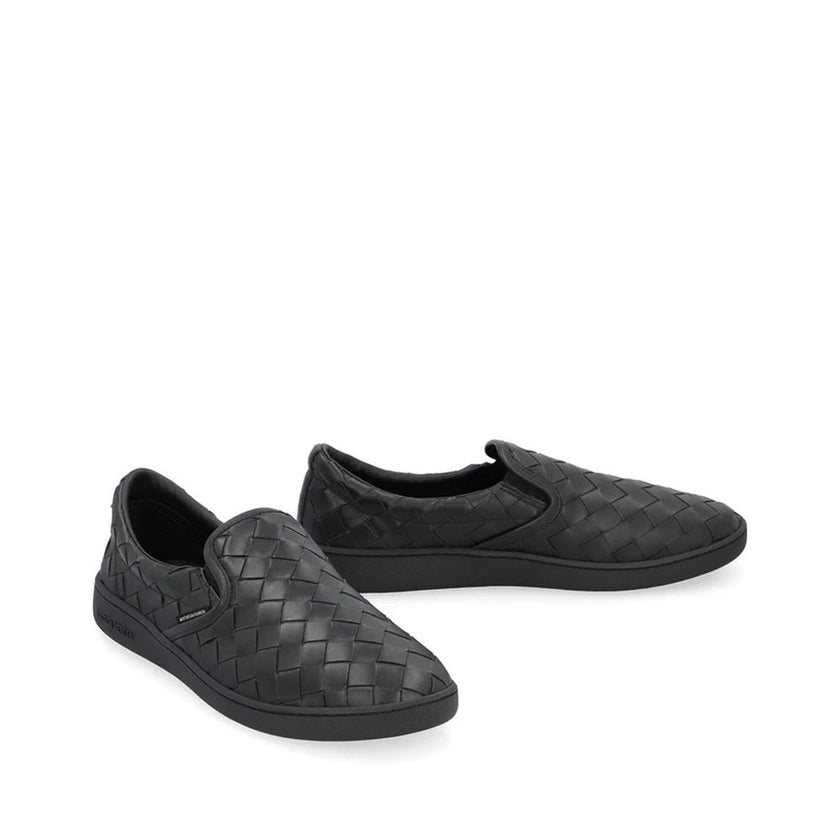 Black Calfskin SneakersDescription: – Composition: 100% calf leather – Inner: Leather – Insole: Leather – Sole: Rubber – Round toe – Branded insole – Elasticated side inserts – Slip-on design – Intrecciato weave – Made in Italy – Gender: MEN –Black Calfsk