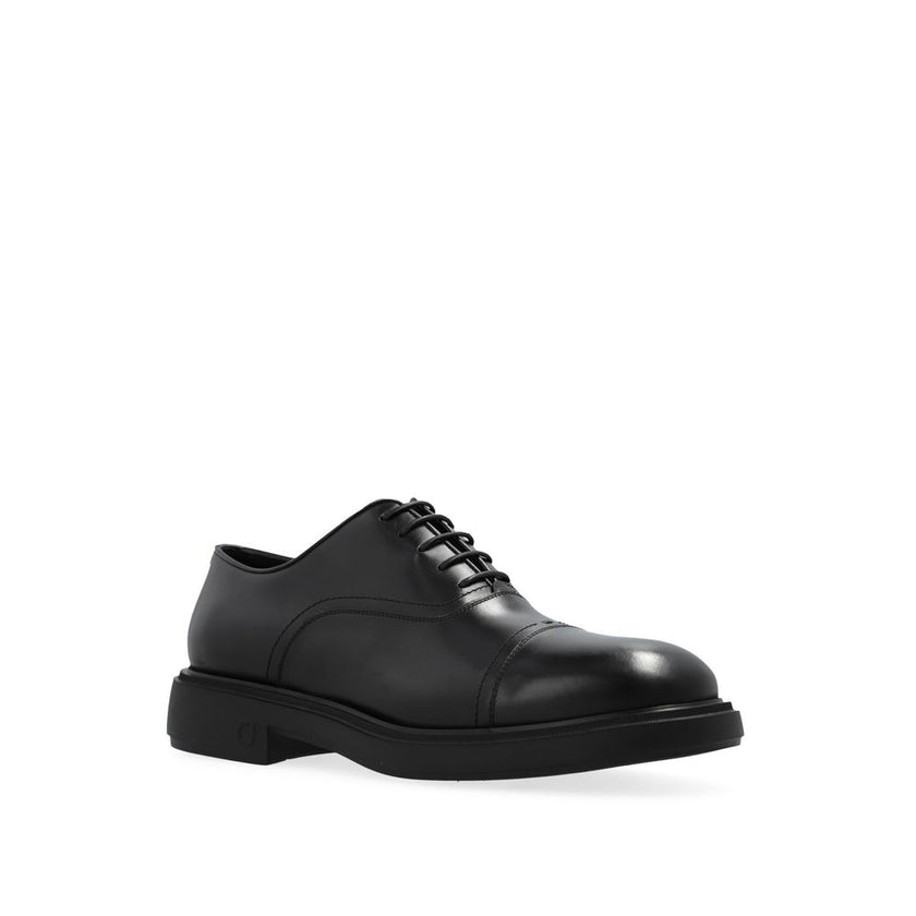 Black Calfskin Oxfords And DerbiesDescription: – Composition: 100% calf leather – Inner: Leather – Insole: Leather – Sole: Rubber – Round toe – Branded insole – Front lace-up closure – Made in Italy – Gender: MEN – Size & Fit: Heel height: 4,5cm Sole Heig