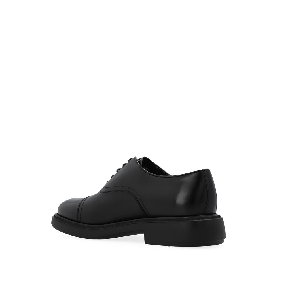 Black Calfskin Oxfords And DerbiesDescription: – Composition: 100% calf leather – Inner: Leather – Insole: Leather – Sole: Rubber – Round toe – Branded insole – Front lace-up closure – Made in Italy – Gender: MEN – Size & Fit: Heel height: 4,5cm Sole Heig