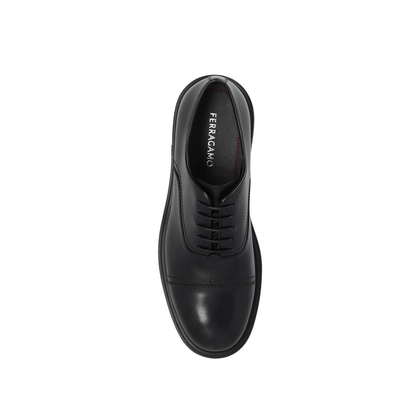 Black Calfskin Oxfords And DerbiesDescription: – Composition: 100% calf leather – Inner: Leather – Insole: Leather – Sole: Rubber – Round toe – Branded insole – Front lace-up closure – Made in Italy – Gender: MEN – Size & Fit: Heel height: 4,5cm Sole Heig