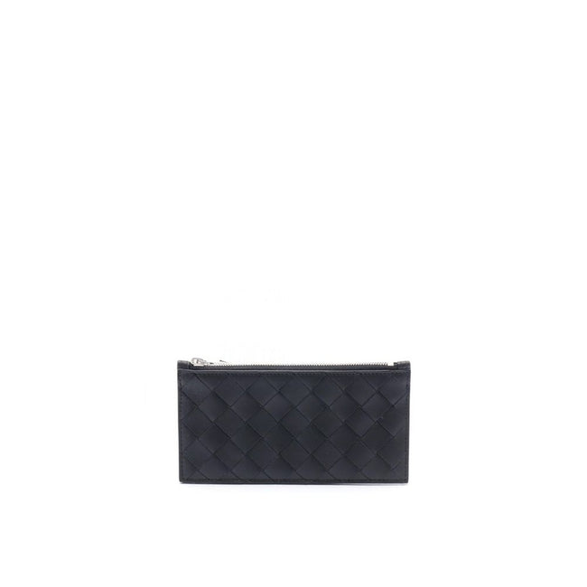Black Calfskin WalletDescription: – Composition: 100% calf leather – Top zip closure – Silver-tone hardware – Height 8 cm – Width 1 cm – Back embossed logo detail – Length 16 cm – Made in Italy – Gender: MEN –Black Calfskin Wallet${tagsBottega VenetaAulae