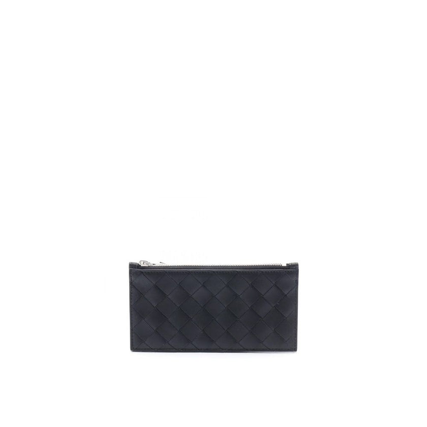 Black Calfskin WalletDescription: – Composition: 100% calf leather – Top zip closure – Silver-tone hardware – Height 8 cm – Width 1 cm – Back embossed logo detail – Length 16 cm – Made in Italy – Gender: MEN –Black Calfskin Wallet${tagsBottega VenetaAulae