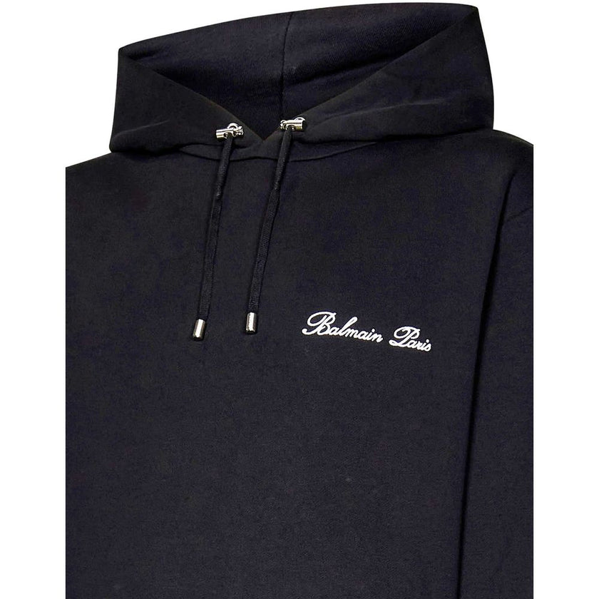 Black Cotton SweatshirtDescription: – Composition: 100% Cotton – Ribbed trims – Machine wash – Drawstring hood – Front embroidered logo detail – Front pouch pocket – Silver metal eyelets, toggles and ends – Made in Portugal – Gender: MEN – Size & Fit: The