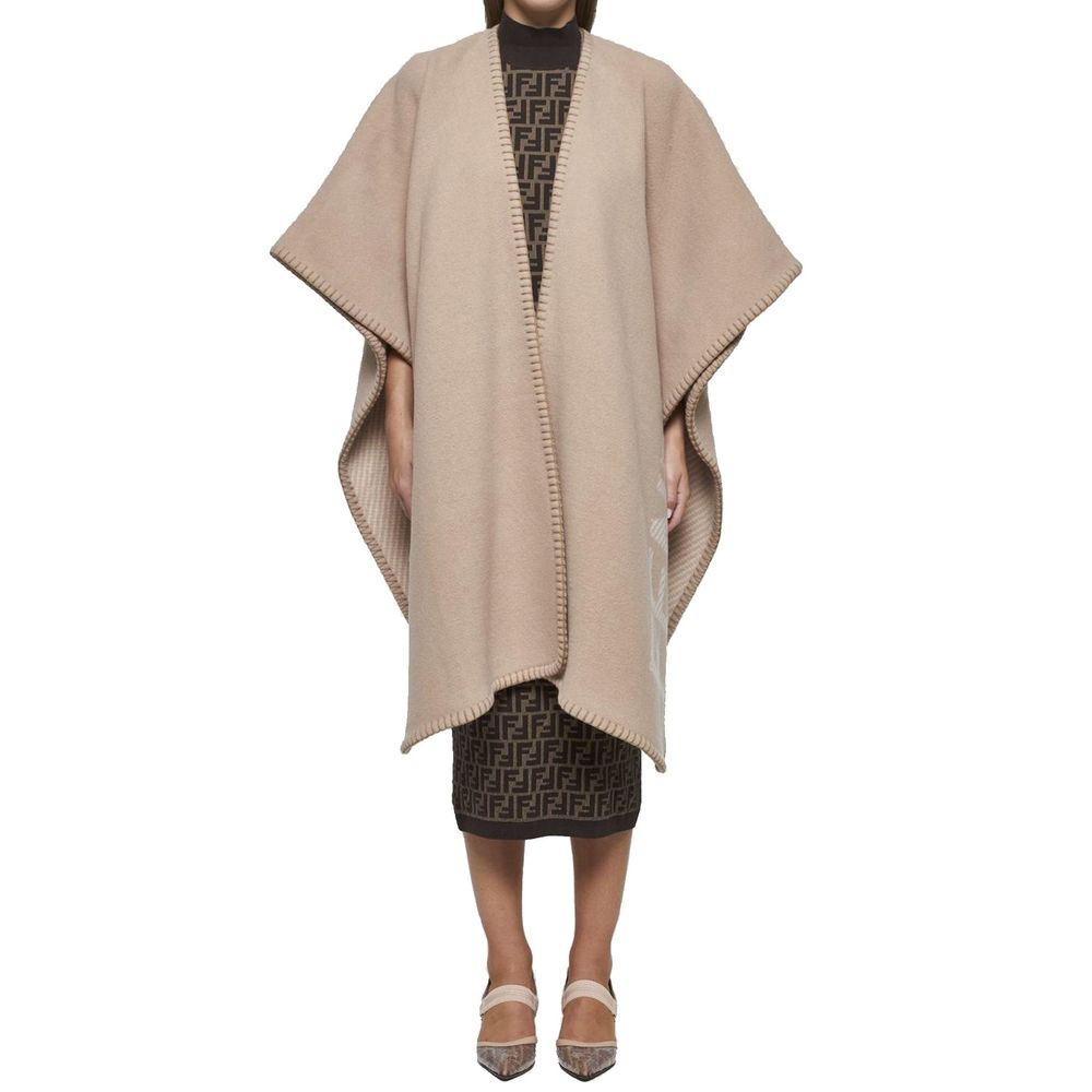 Beige Cashmere PonchoDescription: – Composition: 10% Cashmere 90% Wool – Dry clean – Side logo lettering – Three-quarter sleeves – No closure – Rounded edges – Contrasting topstitching – Made in Italy – Gender: WOMEN – Size & Fit: Deconstructed model with