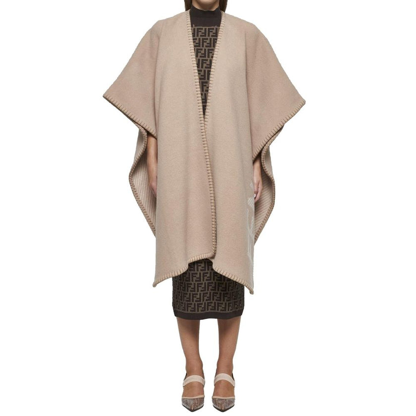 Beige Cashmere PonchoDescription: – Composition: 10% Cashmere 90% Wool – Dry clean – Side logo lettering – Three-quarter sleeves – No closure – Rounded edges – Contrasting topstitching – Made in Italy – Gender: WOMEN – Size & Fit: Deconstructed model with