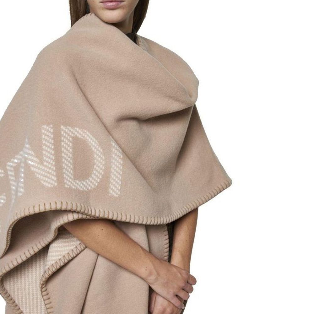 Beige Cashmere PonchoDescription: – Composition: 10% Cashmere 90% Wool – Dry clean – Side logo lettering – Three-quarter sleeves – No closure – Rounded edges – Contrasting topstitching – Made in Italy – Gender: WOMEN – Size & Fit: Deconstructed model with