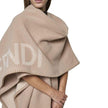 Beige Cashmere PonchoDescription: – Composition: 10% Cashmere 90% Wool – Dry clean – Side logo lettering – Three-quarter sleeves – No closure – Rounded edges – Contrasting topstitching – Made in Italy – Gender: WOMEN – Size & Fit: Deconstructed model with