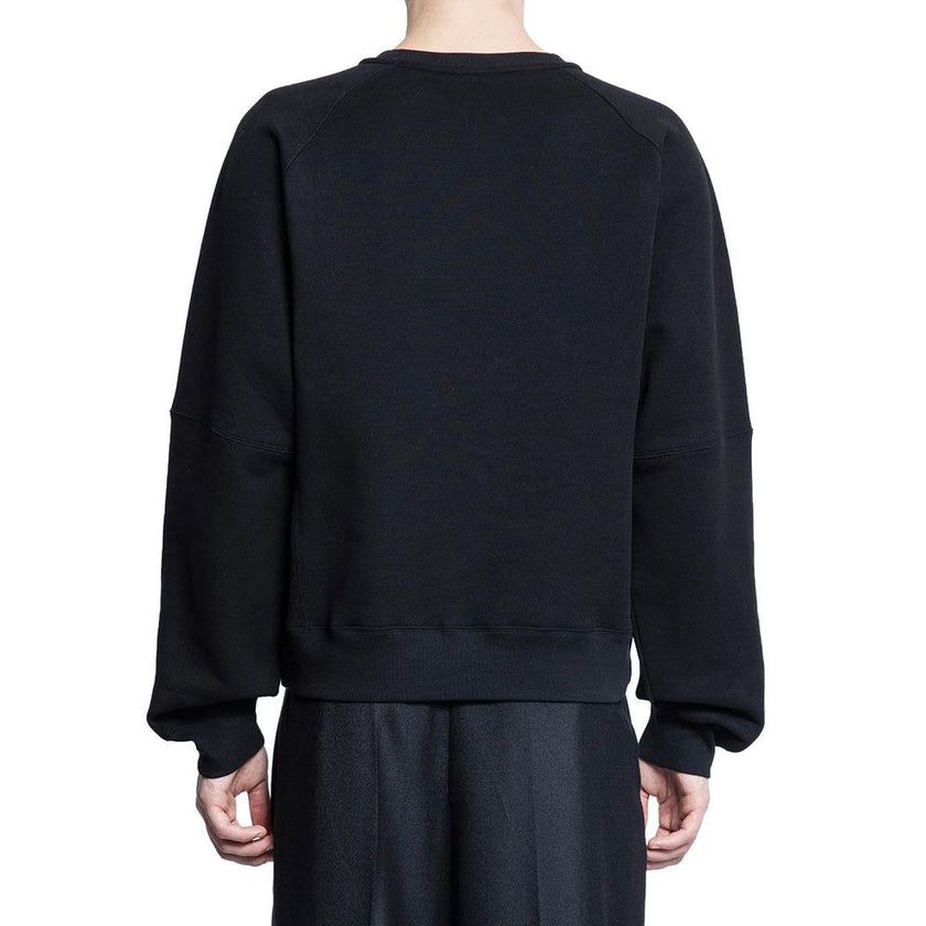 Black Cotton SweatshirtDescription: – Composition: 100% Cotton – Long sleeves – Ribbed trims – Crew neck – Machine wash (delicate) – Embroidered logo on the front – Made in France – Gender: MEN – Size & Fit: Oversize fit.Black Cotton Sweatshirt${tagsSaint