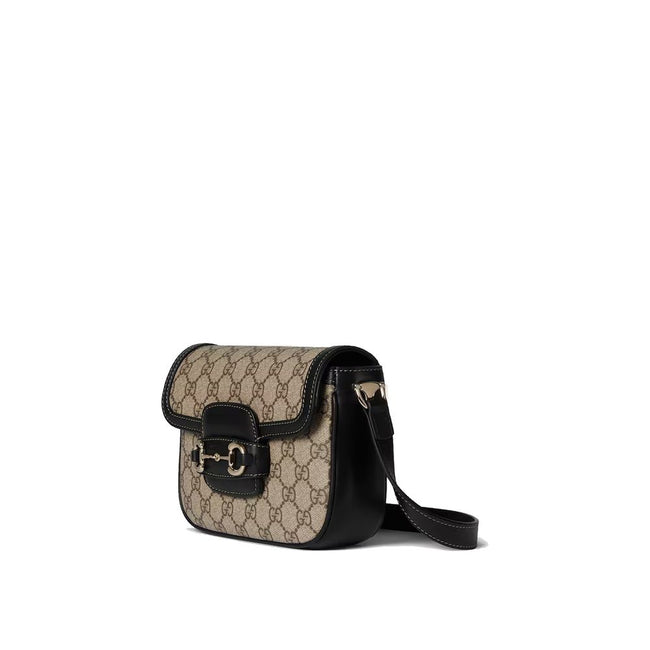 Beige Fabric Shoulder BagDescription: – Composition: 100% Fabric – Lining: Cotton Linen – Leather detail – Flap closure – Adjustable leather shoulder strap – One compartment – Beige and dark brown GG monogram – Light gold-tone trim – Clamp detail on the f
