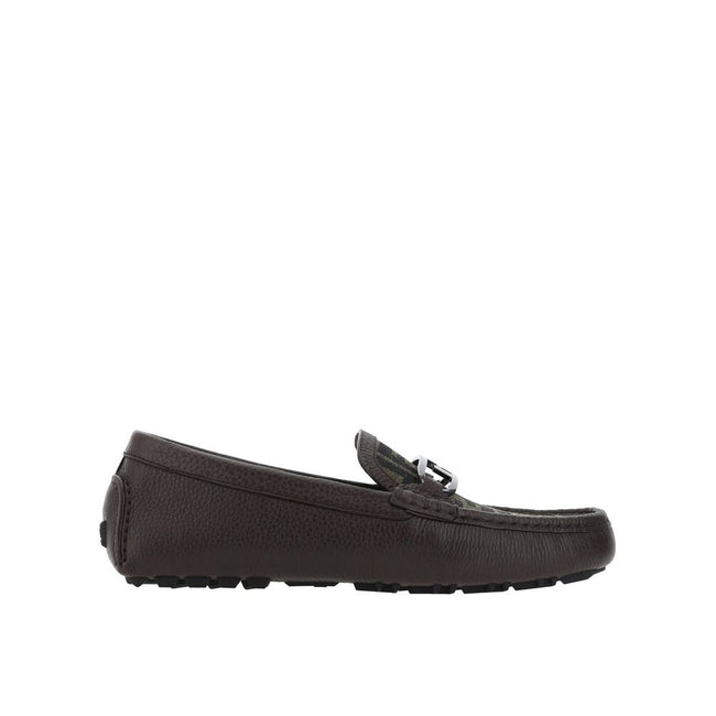Brown Calfskin Slip-On LoafersDescription: – Composition: 100% calf leather – Inner: Leather – Insole: Leather – Sole: Rubber – Textured leather – Almond toe – Slip on – Top metal logo hardware – Made in Italy – Gender: MEN –Brown Calfskin Slip-On Loafers