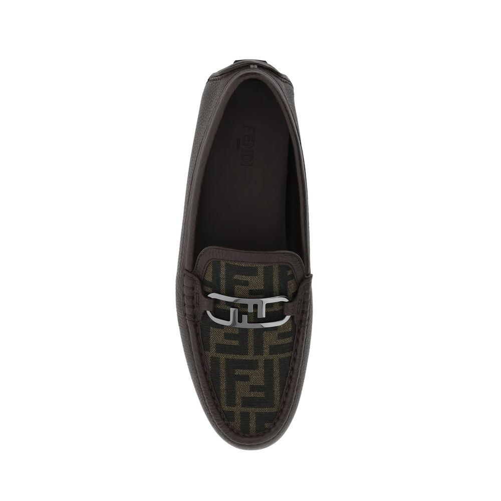Brown Calfskin Slip-On LoafersDescription: – Composition: 100% calf leather – Inner: Leather – Insole: Leather – Sole: Rubber – Textured leather – Almond toe – Slip on – Top metal logo hardware – Made in Italy – Gender: MEN –Brown Calfskin Slip-On Loafers