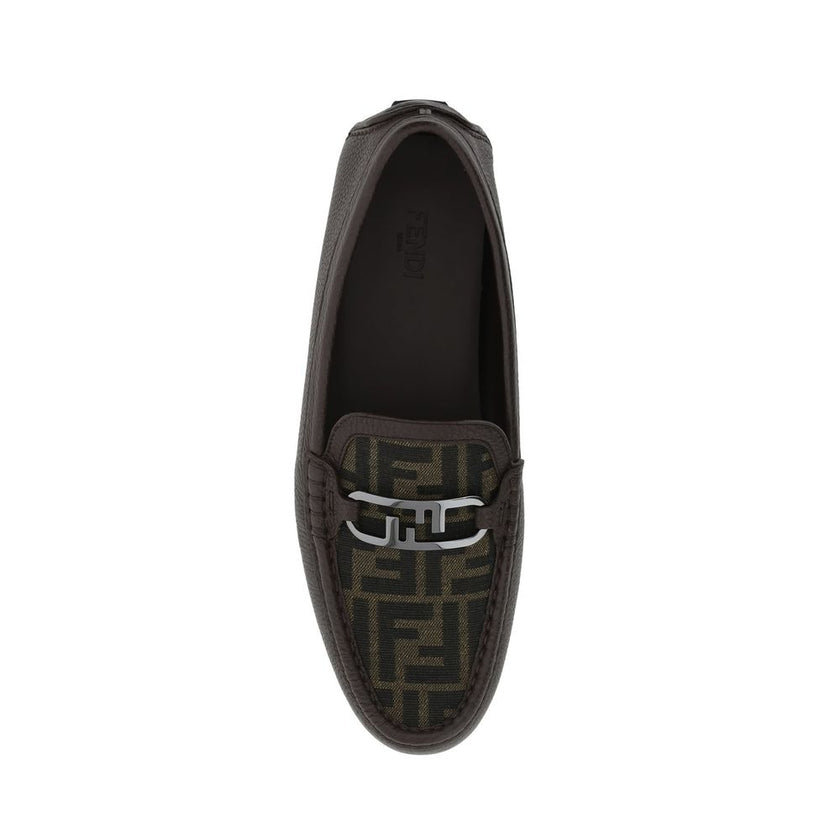 Brown Calfskin Slip-On LoafersDescription: – Composition: 100% calf leather – Inner: Leather – Insole: Leather – Sole: Rubber – Textured leather – Almond toe – Slip on – Top metal logo hardware – Made in Italy – Gender: MEN –Brown Calfskin Slip-On Loafers