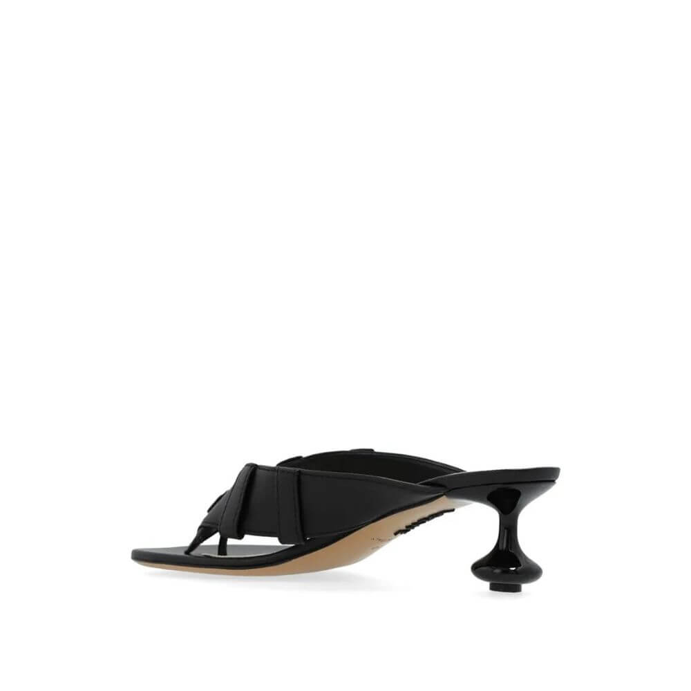 Black Lamb Leather Strap-On SandalsDescription: – Composition: 100% Lamb Leather – Inner: Leather – Insole: Leather – Sole: Leather – Round toe – Branded insole – Heel 4,5 cm – Lacquered signature Toy heel – Designed as a buttoned waistband – Made in Ital