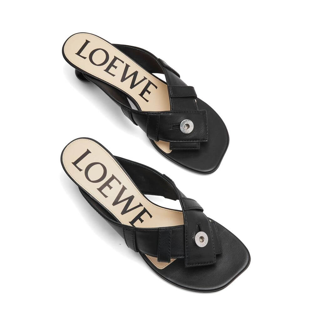 Black Lamb Leather Strap-On SandalsDescription: – Composition: 100% Lamb Leather – Inner: Leather – Insole: Leather – Sole: Leather – Round toe – Branded insole – Heel 4,5 cm – Lacquered signature Toy heel – Designed as a buttoned waistband – Made in Ital