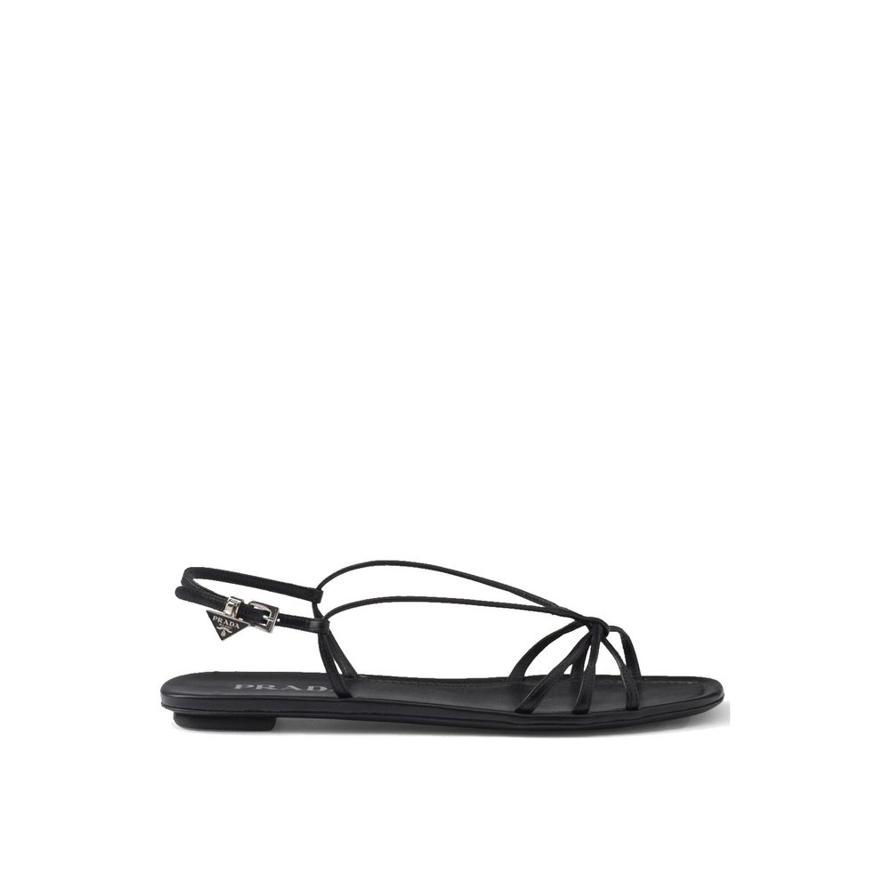 Black Calfskin SandalsDescription: – Composition: 100% calf leather – Inner: Leather – Insole: Leather – Sole: Leather – Open toe – Square toe – Adjustable buckle closure – Branded insole – Enamel triangle logo – Made in Italy – Gender: WOMEN –Black Calfs