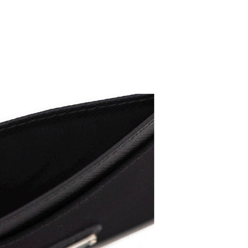 Black Nylon CardholderDescription: – Composition: 100% Nylon – Lining: Leather – Leather detail – Textured leather – Width 1 cm – Length 10,5 cm – Front enamelled metal triangle logo – Height 7 cm – Made in Turkey – Gender: WOMEN –Black Nylon Cardholder${