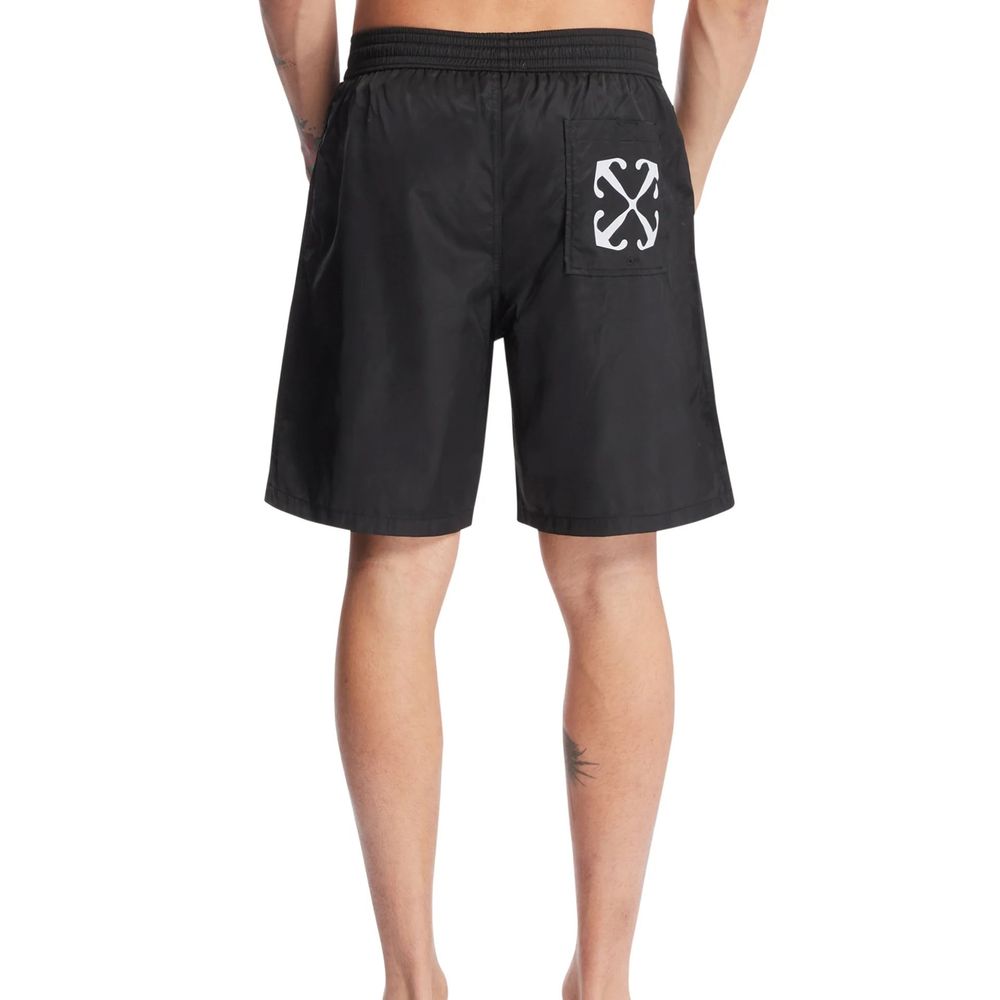 Black Polyester Swim ShortsDescription: – Composition: 100% Polyester – Elasticated waist – Two side pockets – Contrast logo print – Straight cut – Drawstring waist – Mesh lining – Shaped rear pocket – Made in Italy – Gender: MEN –Black Polyester Swim Sho