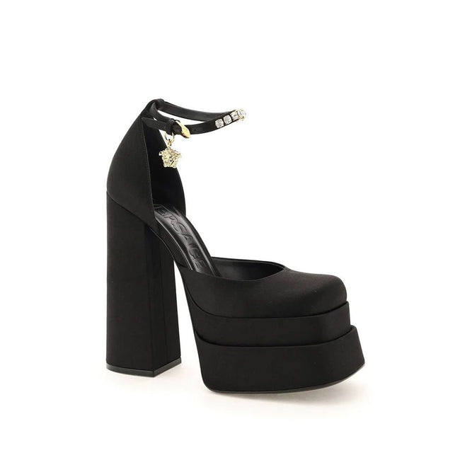 Black Silk Platform PumpsDescription: – Composition: 100% Silk – Insole: Leather – Sole: Leather – Ankle side buckle fastening – Square toe – Crystal embellishments – Medusa charm – Heel 16 cm – Gender: WOMEN – Made in Italy –Black Silk Platform Pumps${ta
