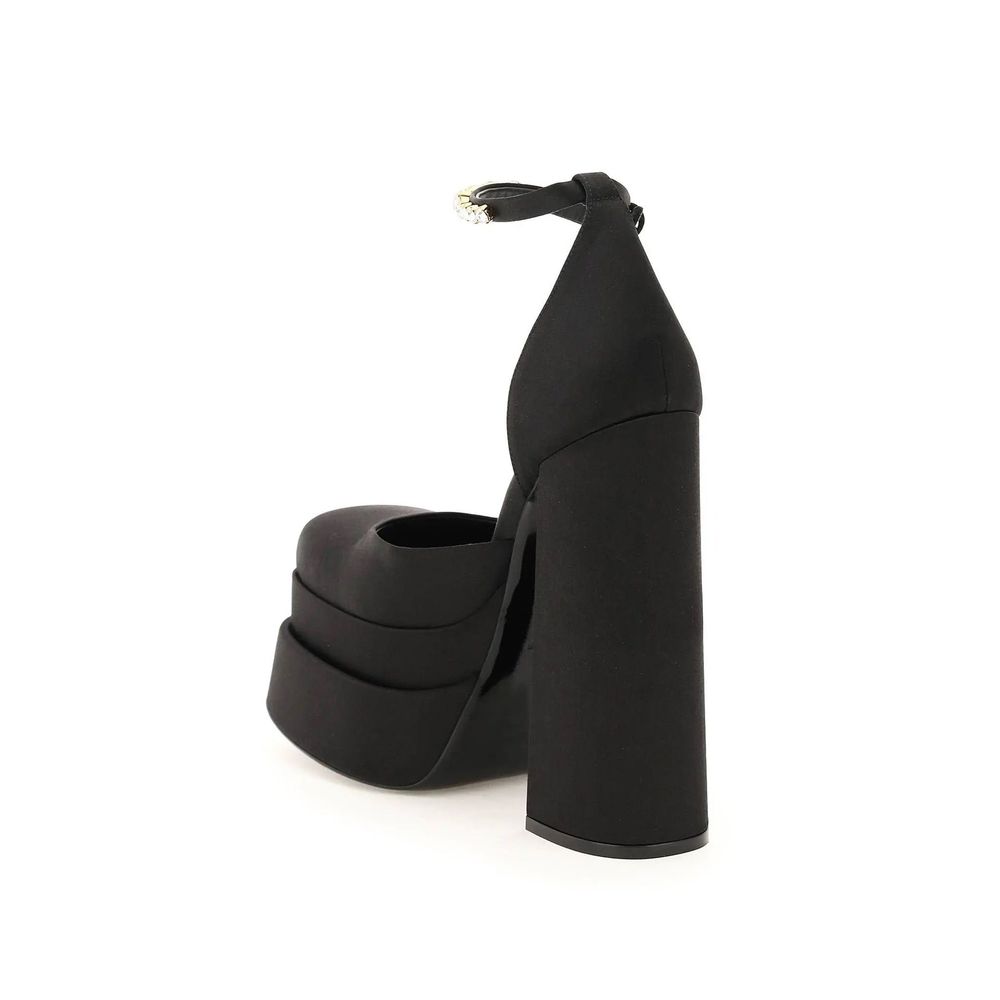 Black Silk Platform PumpsDescription: – Composition: 100% Silk – Insole: Leather – Sole: Leather – Ankle side buckle fastening – Square toe – Crystal embellishments – Medusa charm – Heel 16 cm – Gender: WOMEN – Made in Italy –Black Silk Platform Pumps${ta