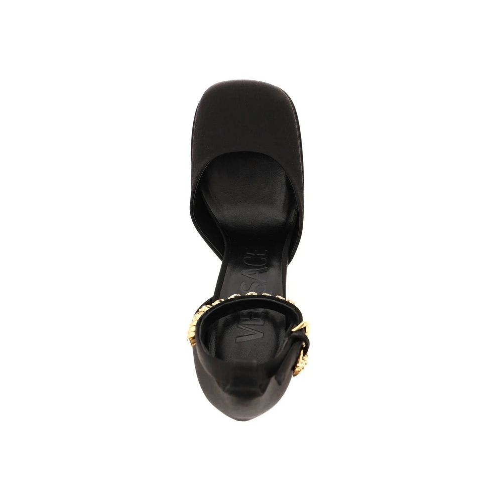 Black Silk Platform PumpsDescription: – Composition: 100% Silk – Insole: Leather – Sole: Leather – Ankle side buckle fastening – Square toe – Crystal embellishments – Medusa charm – Heel 16 cm – Gender: WOMEN – Made in Italy –Black Silk Platform Pumps${ta