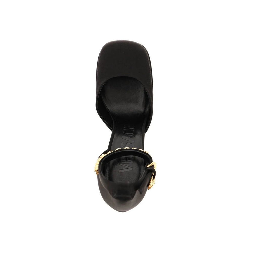 Black Silk Platform PumpsDescription: – Composition: 100% Silk – Insole: Leather – Sole: Leather – Ankle side buckle fastening – Square toe – Crystal embellishments – Medusa charm – Heel 16 cm – Gender: WOMEN – Made in Italy –Black Silk Platform Pumps${ta