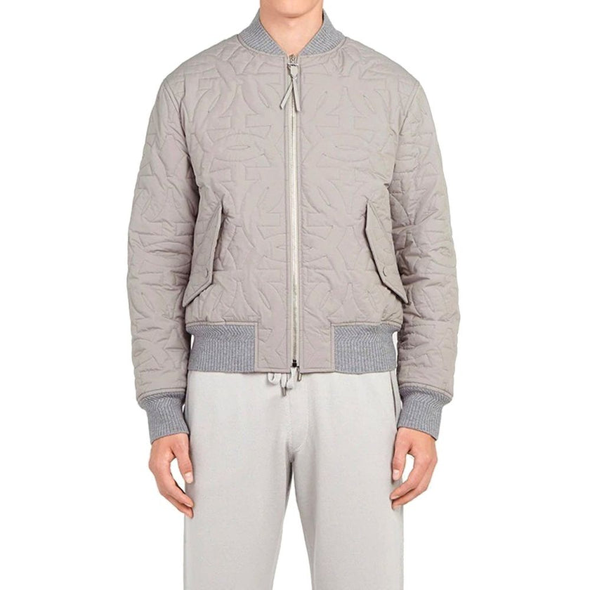 Gray Polyester BomberDescription: – Composition: 100% polyester – Long sleeves – Zip fastening – Ribbed trims – Side pockets with flap – Made in Italy –Gray Polyester Bomber${tagsSalvatore FerragamoAulae Quilted Bomber Jacket Salvatore FerragamoAulae Quil